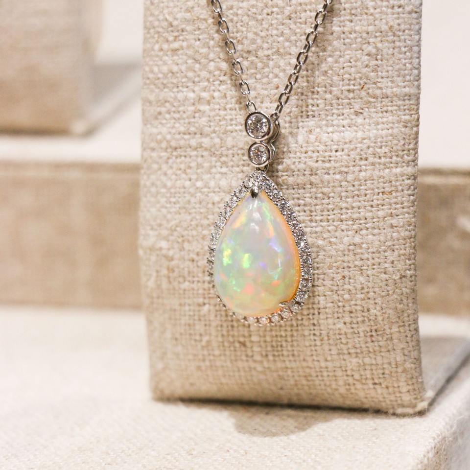 Ethiopian Opal pendant surrounded by diamonds